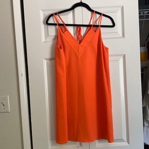 Bright orange shift dress with tie back